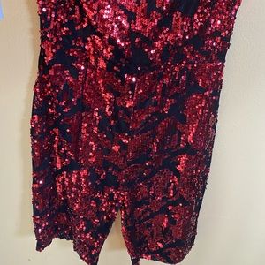 NEW Sleeveless sequenced red and black one piece.